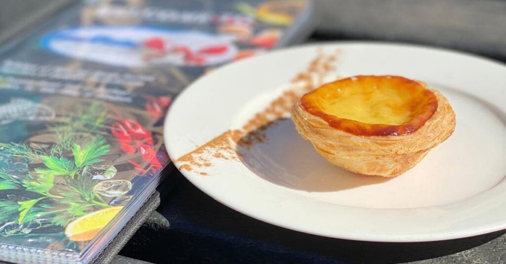 Close-up shot of crispy and golden Pastel De Nata.