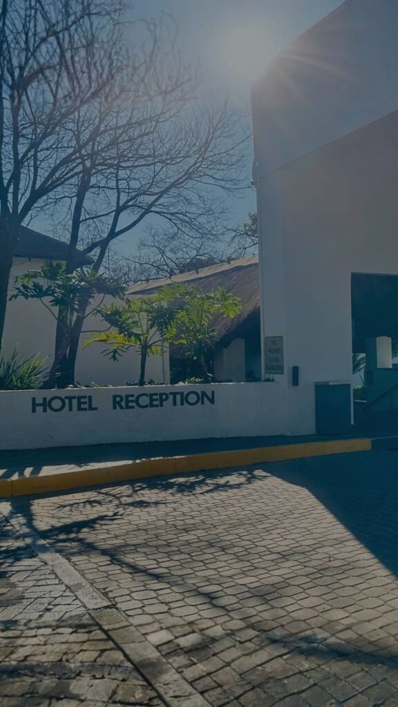Exterior view of the hotel reception entrance and signage at Indaba Hotel Spa and Conference Centre in Johannesburg, South Africa.