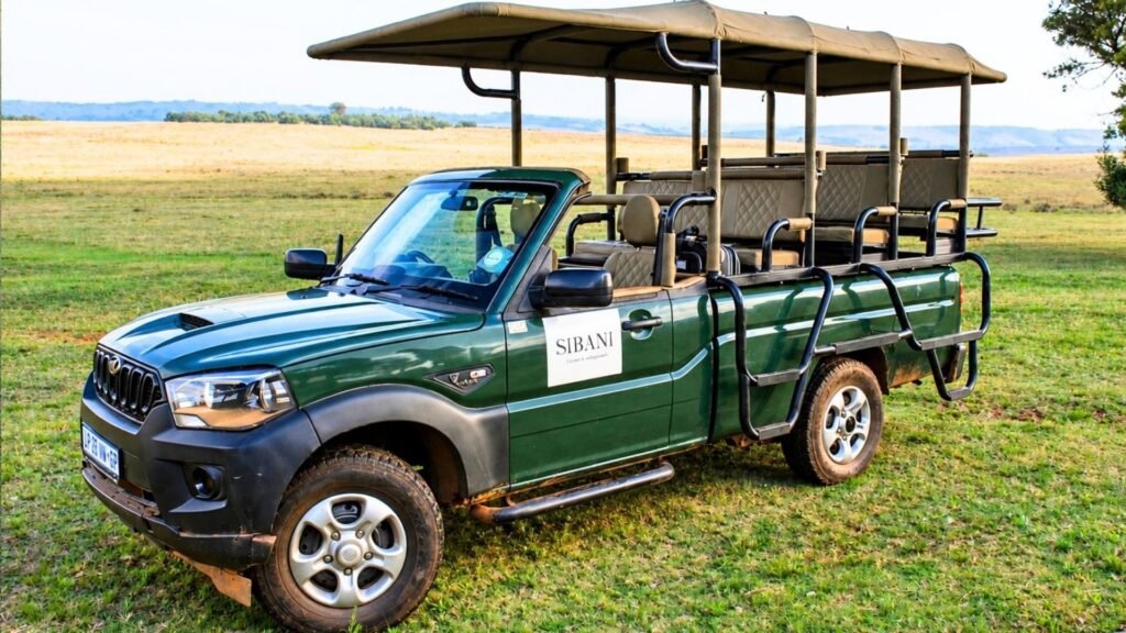 Green open safari vehicle ready for a private game drive at Sibani Lodge