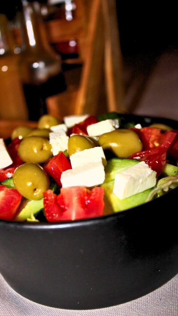 Colourful Greek salad with feta, olives and tomatoes served at Sibani Lodge