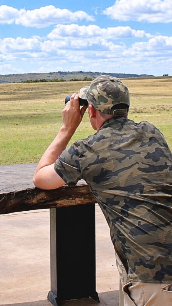 Judd using binoculars during a private game drive at Sibani Lodge Magaliesberg