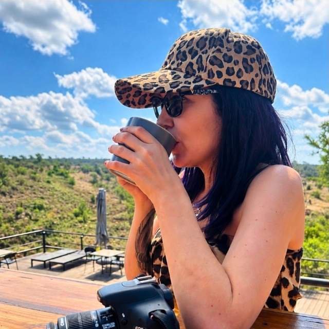 Claudia enjoying coffee while overlooking the bushveld at Sibani Lodge