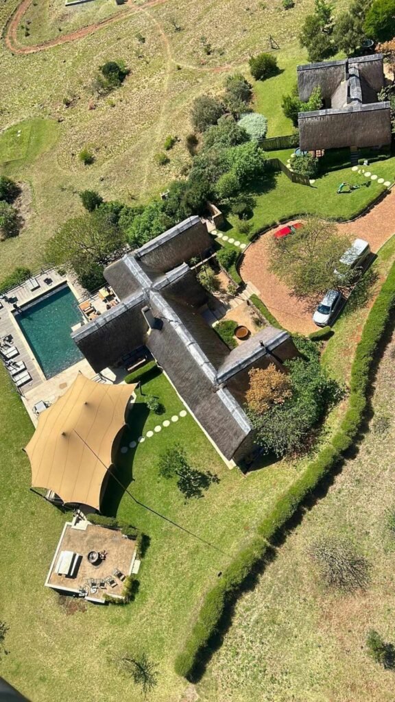 Aerial view of the horseshoe-shaped private villa, pool and grounds at Sibani Lodge
